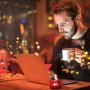 Photo by Andrea Piacquadio: https://www.pexels.com/photo/man-holding-mug-in-front-of-laptop-842548/